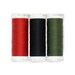 Three spools of red, black, and green thread, isolated on a white background. 