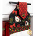 A shot of the top section of the towel taken from a slight angle, showing details on the adorable cat print.