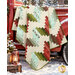 The completed Ridiculously Easy Jelly Roll Quilt colored in fabrics from the Snowtop Mountain Flannel collection by Maywood Studio, artfully draped from the bed of a vintage red truck and staged with coordinating décor in a snowy scene.