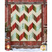 The completed Ridiculously Easy Jelly Roll Quilt colored in fabrics from the Snowtop Mountain Flannel collection by Maywood Studio, staged on a rustic red barn wall with coordinating décor.
