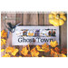 Front of the Ghost Town pattern, displaying the finished project staged on a wood texture with seasonal accents.