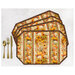 Four placemats fanned out and colored in autumn florals with pumpkins, staged with gold utensils on a white background.