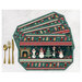 Four placemats fanned out and colored in a teal wintry snowman print, staged with gold utensils on a white background.