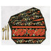 Four placemats fanned out and colored in a black and red floral horizontal print, staged with gold utensils on a white background.
