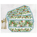 Four placemats fanned out and colored in a beachy Christmas floral print, staged with gold utensils on a white background.