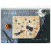 Front of the pattern displaying the finished project staged on a textured surface with pumpkins and scissors.