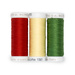 Three spools of red, chiffon yellow, and green thread, isolated on a white background. 