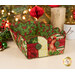 The completed Scalloped Basket, colored in cream, red, and green fabrics from the Deck the Halls collection by Northcott Fabrics, staged on a cream table with coordinating flowers and décor.
