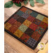 An angled shot of the hot pad, demonstrating details on the fabric prints and colors.