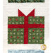 A head on close up on one of the patchwork present blocks, showing clever layout details and fabric prints.