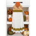 The completed Hanging Towel Kit colored in autumn fabrics from the Bountiful collection by Riley Blake Designs, hung on a drawer surrounded by coordinating décor.