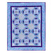 A quilt made using the Inspired Words panel, colored in blue, purple, and white fabrics.