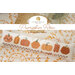 The front of the pattern, showing the finished project displayed on an autumally-themed tabletop and the pattern name at the top..