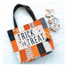 The finished panel project: a trick or treat tote bag on a white background staged with three mini charm packs.