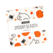 The Spooky Season Mini Charm in its packaging, isolated on a white background. 