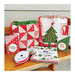 the finished panel projects: drawstring bags and gift card holders staged with ribbon and precut packs on a wooden bench
