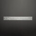 The 1-inch finished size fast fusible grid cutting tool ruler on a black background.