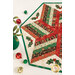 A stylized close up on the topper, showing fabric colors and details; coordinating décor peeks into frame from the left side.