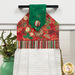 A close up on the top section of the towel, showing details on the ornament fabric as well as the fabric button.