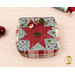 A shot of the pincushion with the three included clay pins poked into the cushion, demonstrating fabric prints and colors.