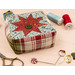 A stylized shot of the pincushion, staged with thread, scissors, pins, and clay specialty pins.