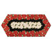 The completed Easy Striped Table Runner, colored in black, red, and cream fabrics with gold metallic accents from the Merry Christmas 2026 collection by Timeless Treasures, isolated on a white background.