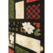 An angled close up on the patchwork, demonstrating fabric prints, colors, and top quilting effects.