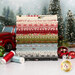 A stack of the fabrics included in the Christmas Vacation collection, with trees and a truck and ornaments and thread.
