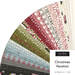 Assorted Christmas-themed fabric strips fanned out in a semicircle, labeled Christmas Vacation.