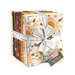 A bundle of fat quarter squares featuring autumn-inspired patterns, tied with a measuring tape ribbon.