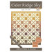 front cover of the Cider Ridge Sky quilt pattern cover featuring the finished geometric star quilt.