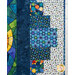 A close up on the patchwork border, showing fabric print and color details.