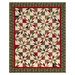 The completed Playing Favorites Quilt, colored in rich cream, red, and sage and forest green fabrics from the Candlelight Christmas collection by Moda Fabrics, isolated on a white background. 