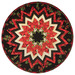 The completed Point of View Kaleidoscope Folded Star Table Topper colored in black, red, and cream fabrics with gold metallic accents from the Merry Christmas 2026 collection by Timeless Treasures, isolated on a white background. 