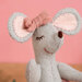 Gray felt mouse head with large pink inner ears, a pink bow, embroidered closed eye, and brown nose.