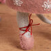 Gray felt mouse leg with a pink ballet slipper tied with red thread around the ankle.