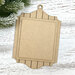 Unfinished layered MDF ornament display with a shiplap-style frame and two rectangular mounting boards for holding a small stitched piece.