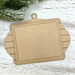 Unfinished layered MDF ornament display with a shiplap-style frame, hanging loop, and rectangular mounting boards for holding a small stitched piece.