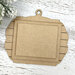 Unfinished layered MDF ornament display with a shiplap-style backing and two rectangular mounting boards for holding a small stitched piece.