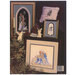 back cover of the Tis The Season Stoney Creek Cross Stitch Book featuring some of the finished Christmas patterns.