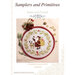 Front cover of the Santa and Friends cross stitch pattern in a circle hoop next to buttons, acorns, pine boughs, and bells.
