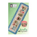 Front cover of the Blooming Tiny Town finished pattern isolated on a green background.