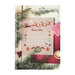 Front cover of the Santa's Advent Calendar cross stitch pattern showing the finished pattern laid on a wooden plank table next to a candle, a striped box, and pine boughs.