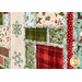 An angled close up on the quilt, demonstrating fabric prints, colors, and ragged details.