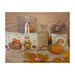 Photo of both the finished Autumn is Here cross stitch patterns laid on a wood plank table next to glass vases, leaves, pumpkins, and a squirrel.