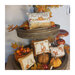 Photo of the four Autumn Pillow designs stacked on a tower of leaves, pumpkins, berries, and a squirrel hanging on a vase.