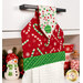 An angled close up on the top of the towel, demonstrating fabric colors on the prints and fabric button.