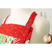 A close up on the adjustable neck strap of the apron.