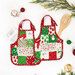 Two festive apron hot pads colored in bright red, green, and white fabrics from the Snow Time collection by Moda Fabrics, staged on a clean white table with coordinating décor, a wooden spoon, and a recipe card.