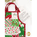 A close up on one of the apron hot pads, showing detail on the fabrics and lace trim of the dimensional pocket.